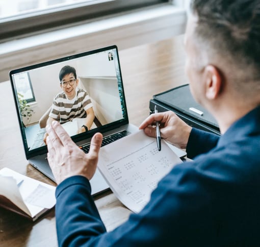 men using the laptop to conduct a video conference